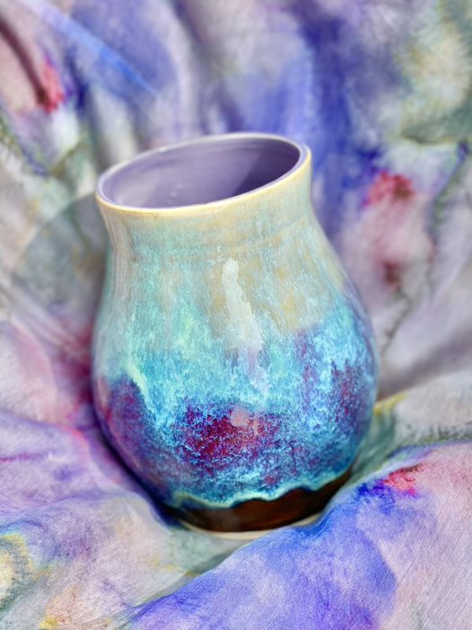 Dawn's Firefly vase which gives off a feeling of starry night and an adventure in space 